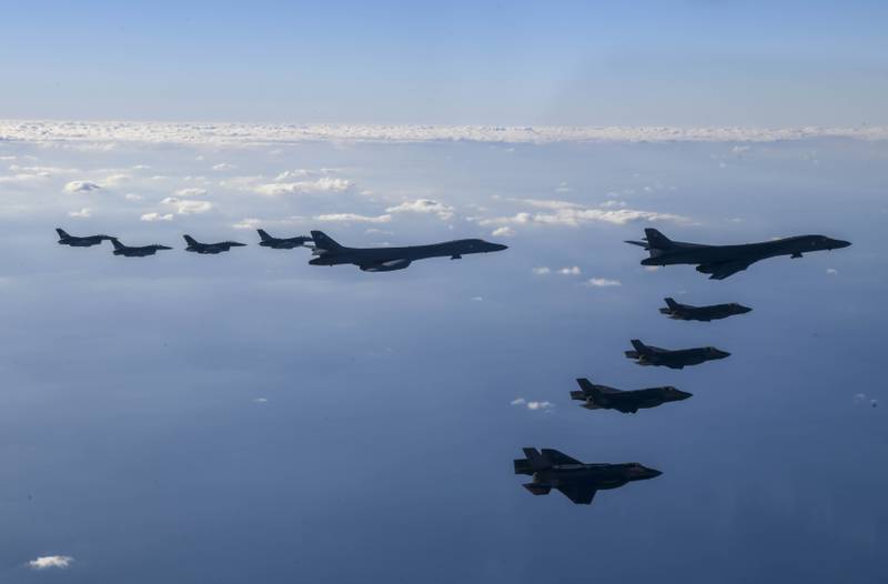 In this photo provided by South Korean Defense Ministry, two U.S. Air Force B-1B bombers, top center, four South Korean Air Force F-35 fighter jets and four US Air Force F-16 fighter jets fly over South Korea Peninsula during a joint air drill called "Vigilant Storm," in South Korea, Saturday, Nov. 5, 2022.