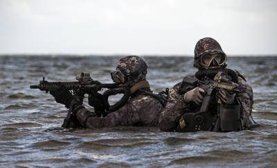 Sailors assigned to Naval Special Warfare Group 2 conduct military dive operations off the East Coast