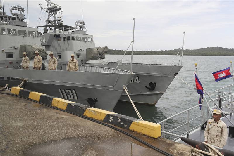 Cambodian navy troop members stand on a navy boat at Ream Naval Base in Sihanoukville, Cambodia, on July 26, 2019.