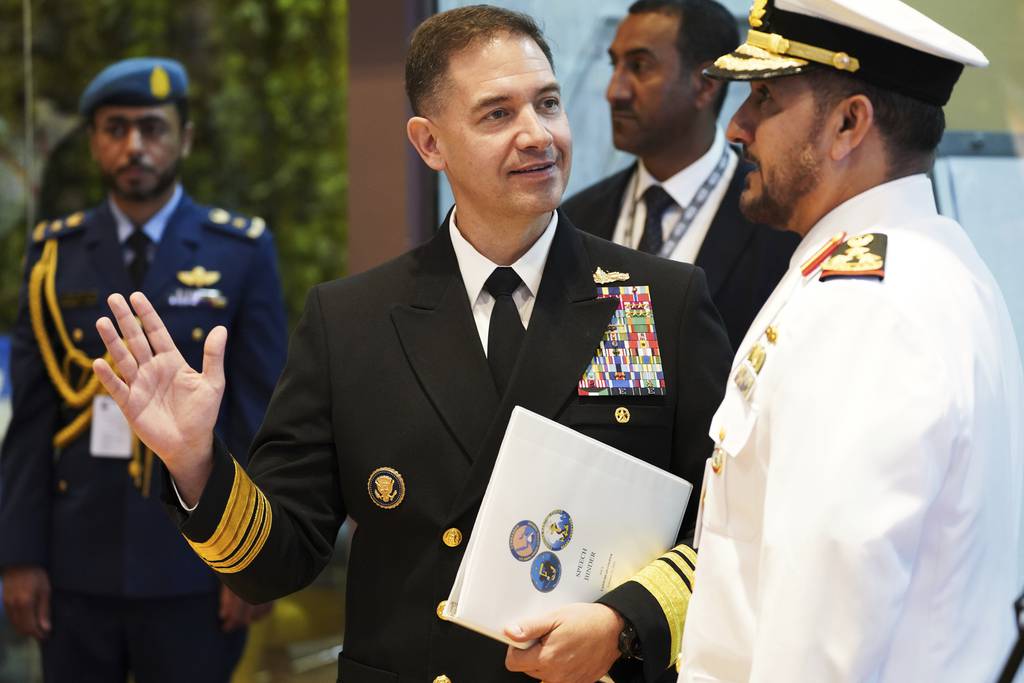 U.S. Navy Vice Adm. Brad Cooper, who heads the Navy's Bahrain-based 5th Fleet, gestures on the sidelines of an event at the International Defense Exhibition and Conference in Abu Dhabi, United Arab Emirates, Tuesday, Feb. 21, 2023.
