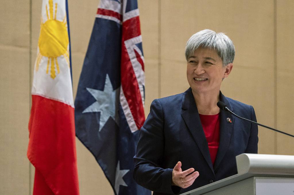 Australian Foreign Minister Penny Wong speaks beside Philippine Foreign Affairs Secretary Enrique Manalo during a joint press conference at a hotel in Makati City, Philippines on Thursday May 18, 2023.