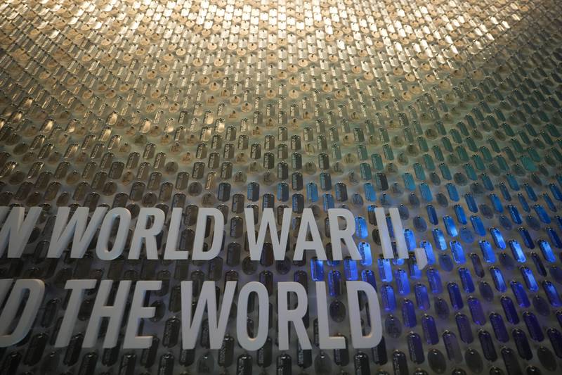 Replicas of real dog tags worn by U.S. soldiers in World War II cover the entry wall to the new pavilion that will be opening at the National World War II Museum, in New Orleans, Tuesday, Oct. 31, 2023.