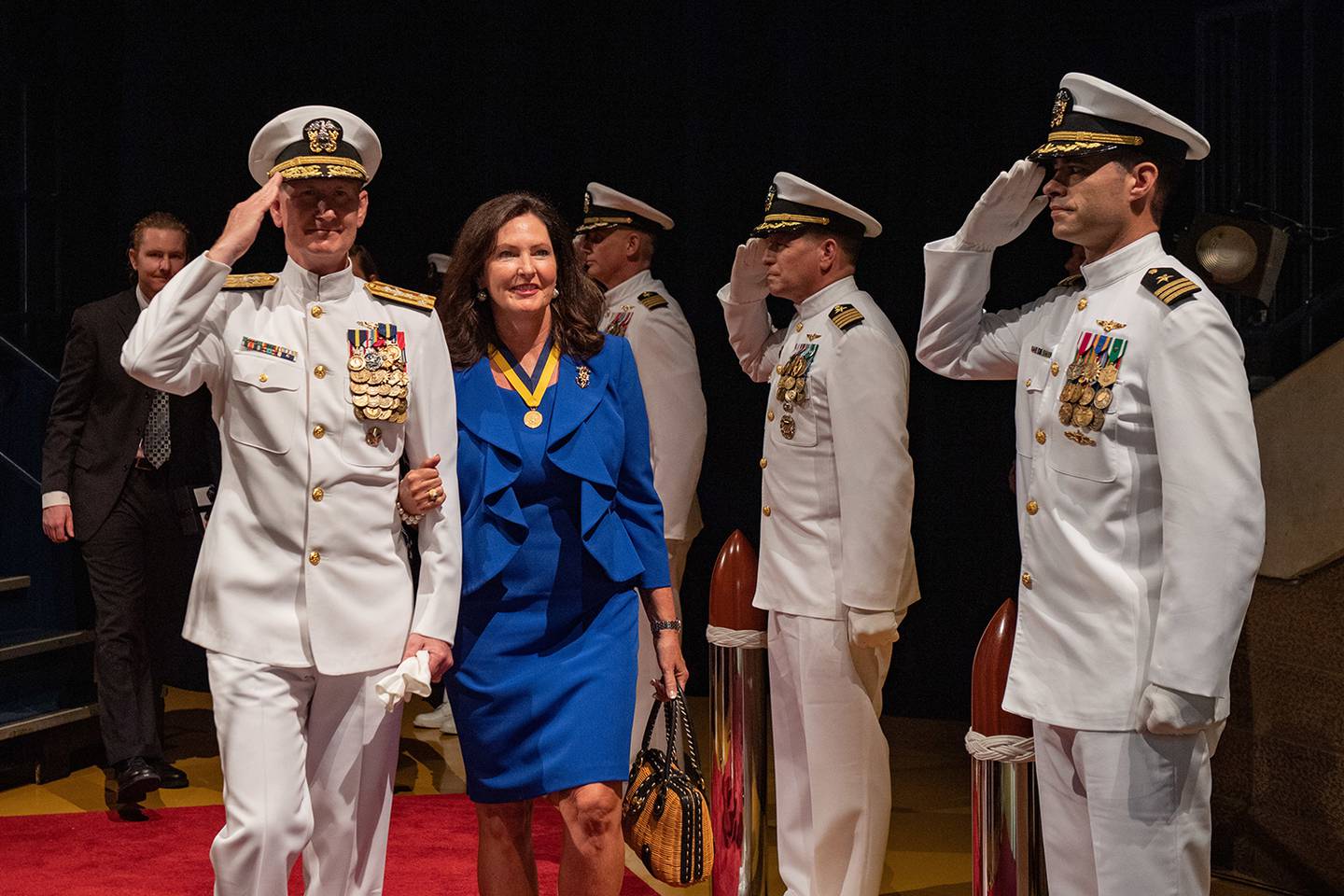 Sideboys render honors as Vice Adm. Walter E. “Ted” Carter Jr. and his family are piped ashore for the last time after 38 years of active duty naval service on July 26, 2019, at Annapolis, Md.