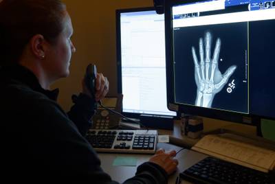 Lt. Cmdr. Victoria Campbell, assigned to Naval Hospital Camp Pendleton, reviews an x-ray in the radiology department on May 3, 2019.