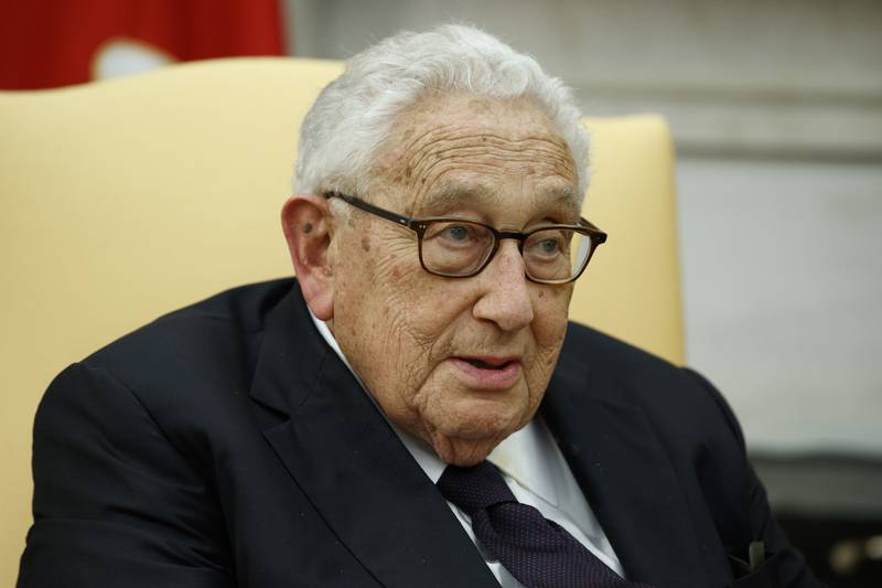 Former Secretary of State Henry Kissinger speaks during a meeting with President Donald Trump in the Oval Office of the White House, Oct. 10, 2017, in Washington.