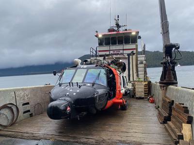 This image provided by the U.S. Coast Guard District 17 PADET Anchorage shows a U.S. Coast Guard MH-60 Jayhawk helicopter from Air Station Sitka on a boat after being recovered from the site of a crash near Read Island, Alaska, Friday, Dec. 8, 2023.