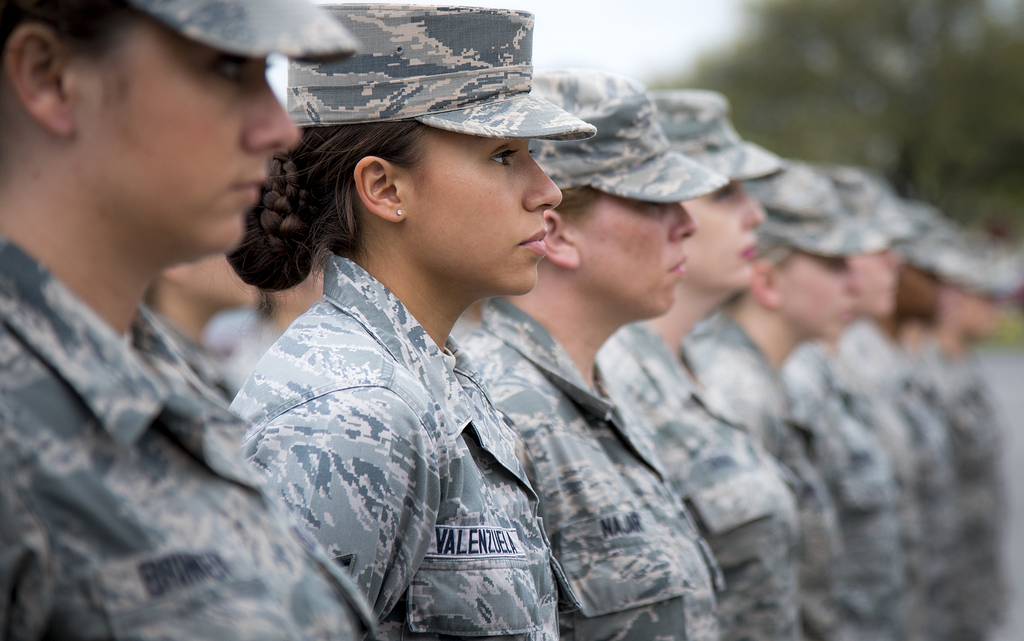 Senior Airman Heather Valenzuela, 96th Medical Group, stands at parade rest as part of an all-female formation prior to the base retreat ceremony March 30, 2017, at Eglin Air Force Base, Fla.