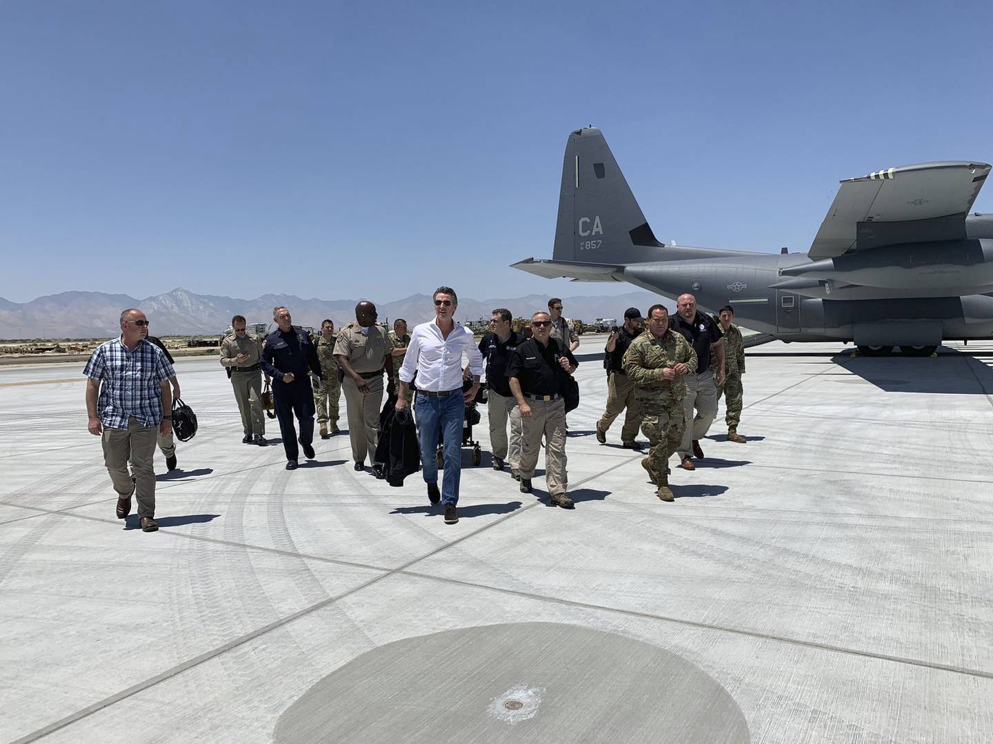 Gov. Gavin Newson, center, arrives with state leadership on the ground in Kern County on July 6, 2019, on his way to assess damages and meet with local responders on the series of major shaking in the city of the Ridgecrest, Calif.