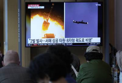 A TV screen shows file images of North Korea's missile launch during a news program at the Seoul Railway Station in Seoul, South Korea, Thursday, Oct. 13, 2022.