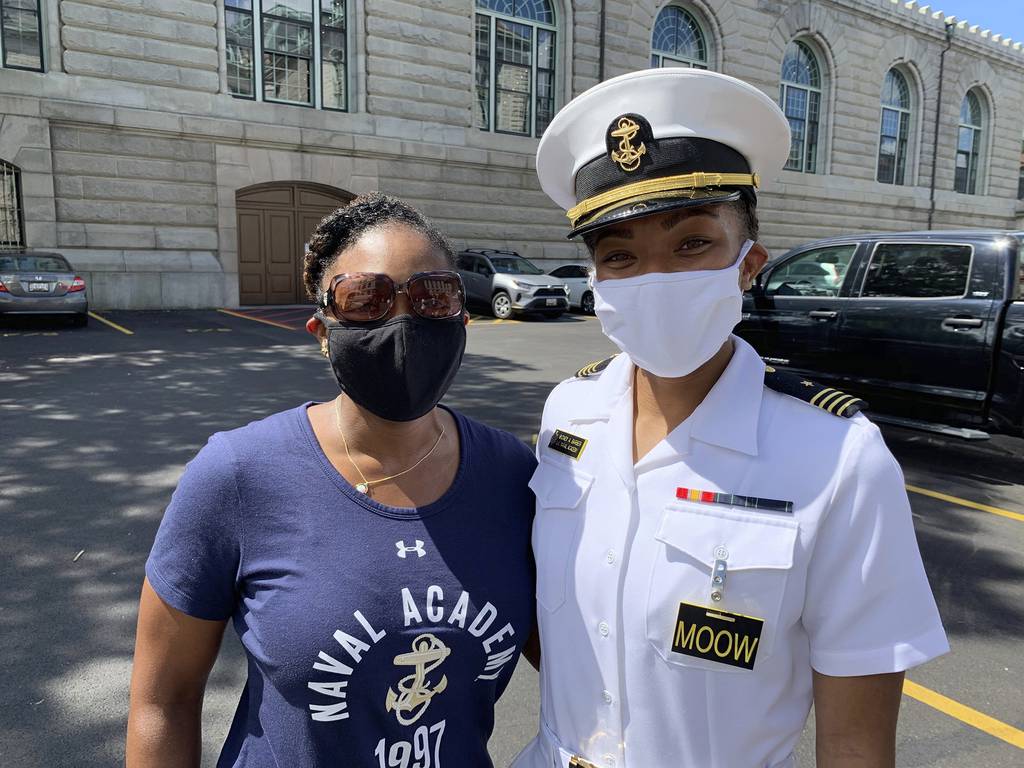 Navy Capt. Tasya Lacy, left, a 1997 graduate of the U.S. Naval Academy, stands next to Midshipman Sydney Barber on Aug. 30, 2020, in Annapolis, Md.
