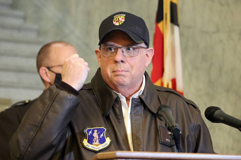 Maryland Gov. Larry Hogan holds his hand up during a news conference in Annapolis, Md., on Thursday, Jan. 7, 2021, as he describes phone conversations he had with Maryland Rep. Steny Hoyer and Secretary of the Army Ryan McCarthy on sending Maryland National Guard members to help protect the U.S. Capitol after rioters stormed the building a day earlier.