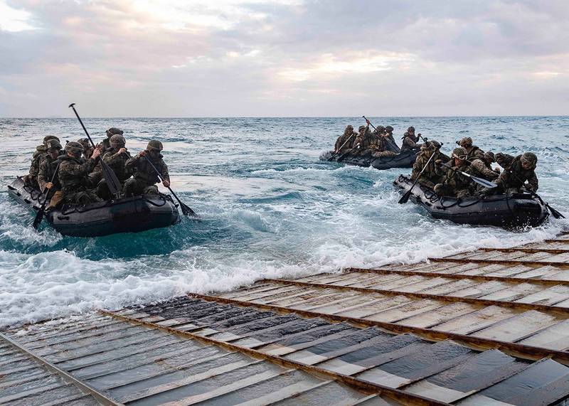 Marines launch in combat rubber raiding crafts from the stern gate of the amphibious dock landing ship USS Ashland (LSD 48) on July 3, 2019, in the Coral Sea.