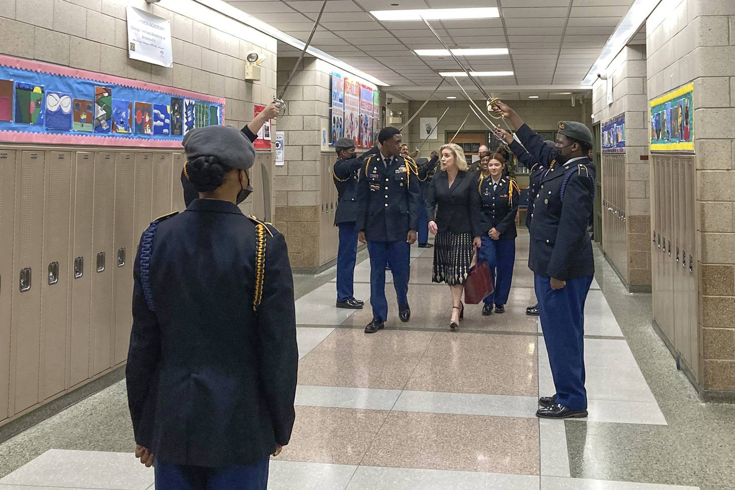 Army Secretary Christine Wormuth is greeted at the Chicago Military Academy as she heads into meetings with young members of the Reserve Officers' Training Corps in Chicago, on Feb. 15, 2023.