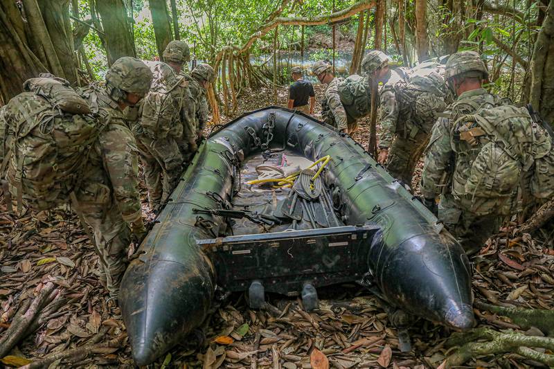 Soldiers assigned to the 25th Infantry Division conduct waterborne operations during patrol lanes at the Jungle Operations Training Course, Schofield Barracks East Range Training Complex, Hawaii, June 13, 2020.