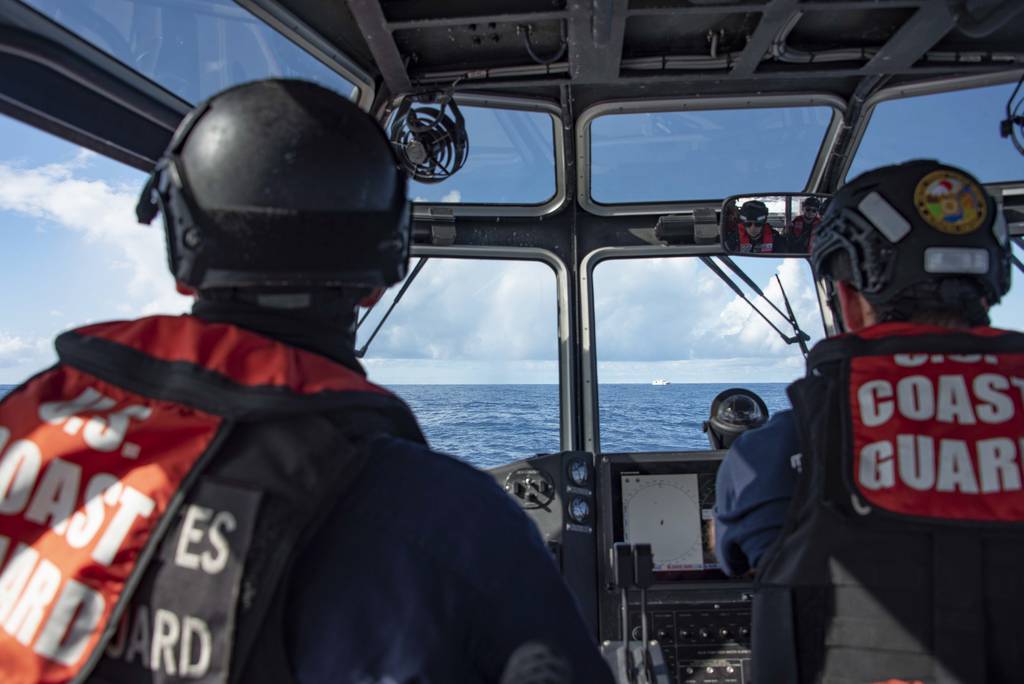 U.S. Coast Guard crew members assigned to the cutter Stratton drive a long range interceptor boat towards a Taiwan fishing vessel during illegal, unreported, and unregulated fishing operations in the Pacific Ocean, Feb. 2, 2022.