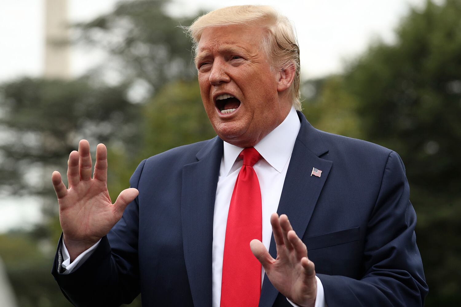 President Donald Trump speaks to members of the media on the South Lawn of the White House in Washington, Monday, Sept. 9, 2019,