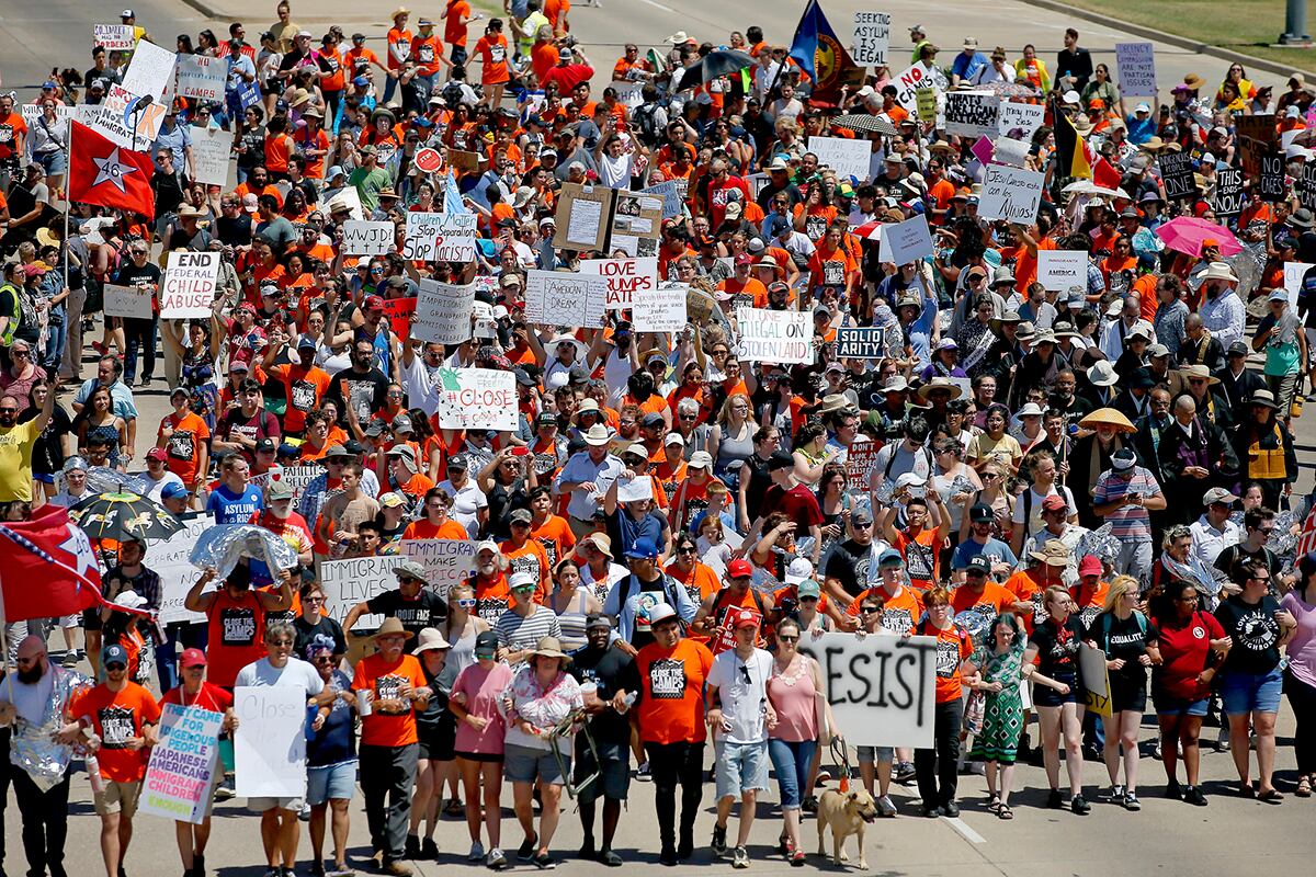 In this July 20, 2019, file photo, protesters march outside Fort Sill in protest of plans to place migrant children at the Army post in Lawton, Okla.