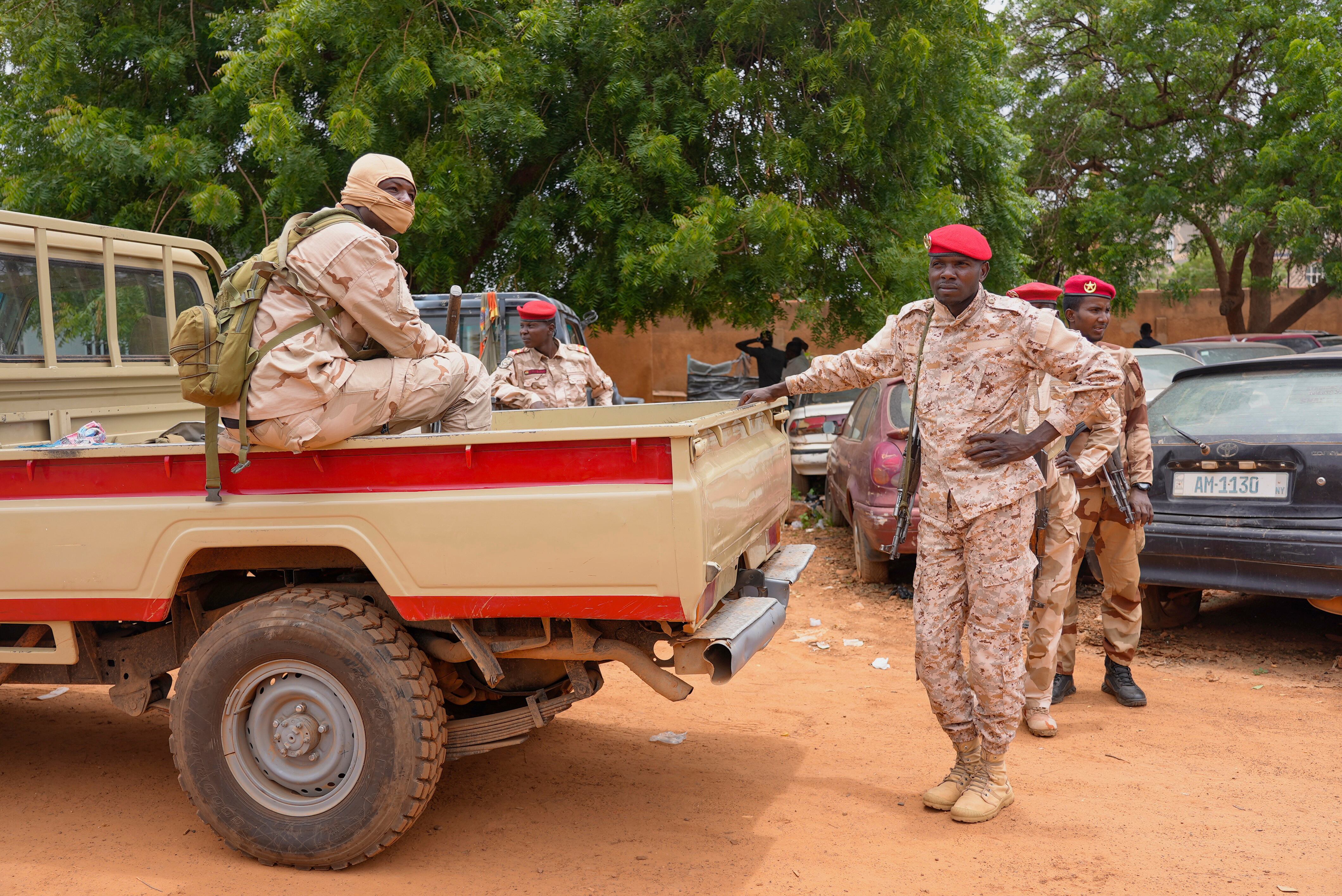 Nigerien national guardsmen sit outside the customs offices in Niamey, Niger, Monday, Aug. 21, 2023.