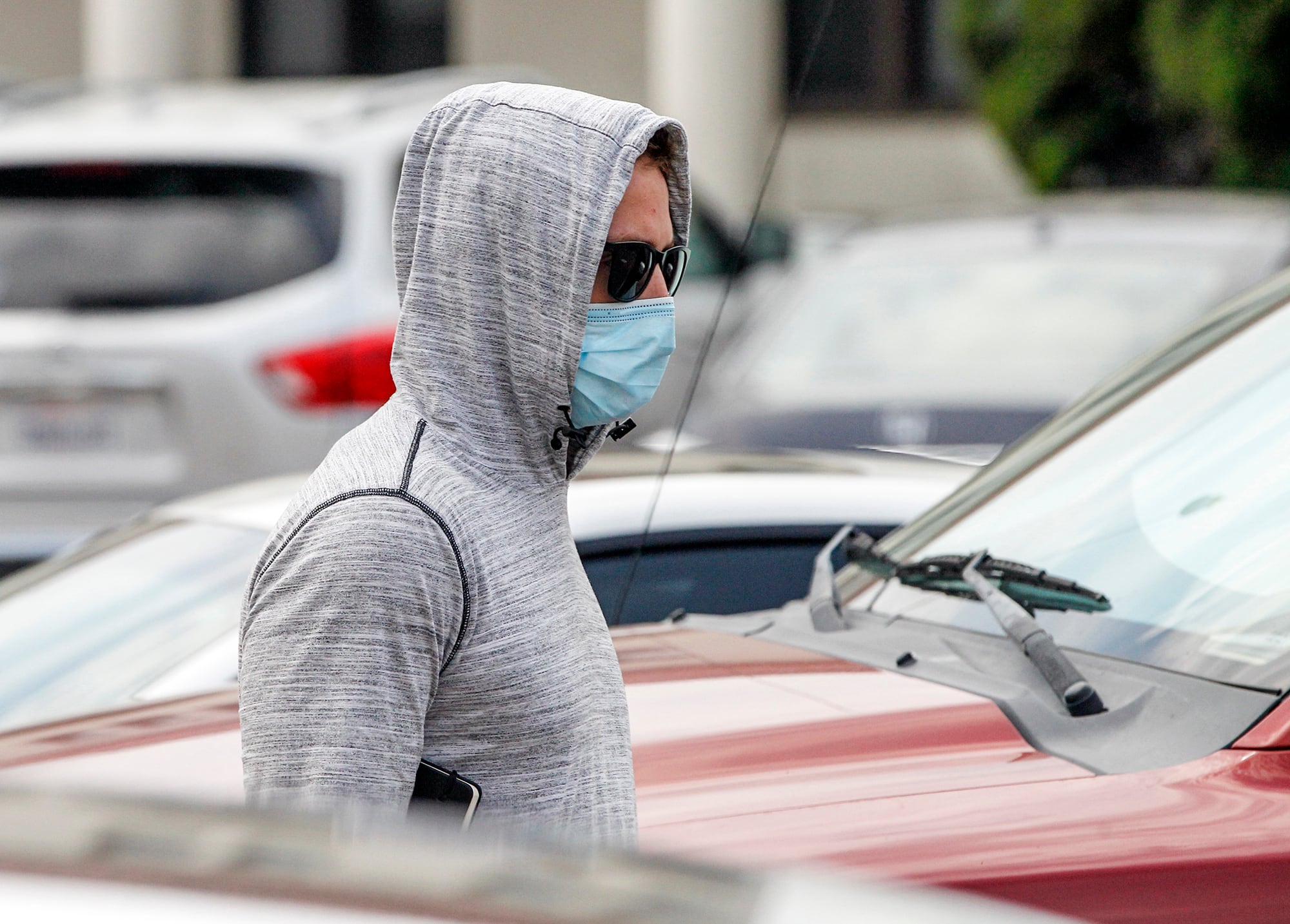 Petty Officer First Class Adel Enayat leaves the building after appearing for a hearing at Naval Base San Diego, Friday, Aug. 21, 2020, in San Diego.
