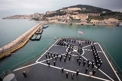 The crew of the USS Mount Whitney stands in formation during the ship’s 50th anniversary celebration in Gaeta, Italy, Jan. 14, 2021.