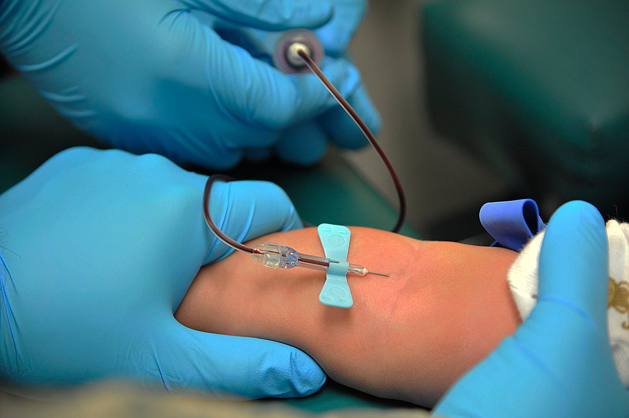 A phlebotomist performs a venipuncture procedure on a patient at Whiteman Air Force Base, Mo., March 18, 2015.