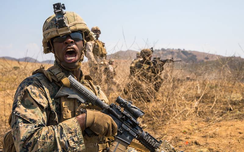 Marine Corps Lance Cpl. Joshua Anderson relays commands to his fire team while conducting offensive operations during the Supersquad 2020 Competition at Marine Corps Base Camp Pendleton, Calif., Aug. 20, 2020.