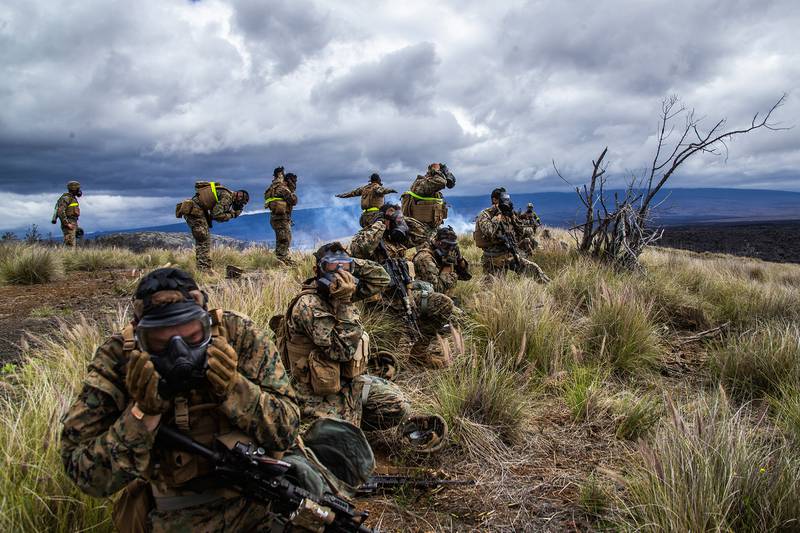 Marines prepare for a dose of compound 2-chlorobenzalmalononitrile "CS" gas during Exercise Bougainville II on Range 10, Pohakuloa Training Area, Hawaii