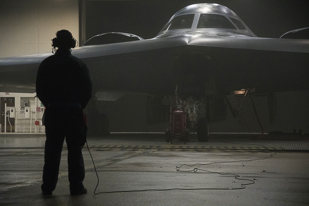 A 509th Maintenance Group airman prepares a B-2 Spirit stealth bomber for takeoff from Whiteman Air Force Base, Missouri, March 15, 2021, in support of a Bomber Task Force mission. Bomber Task Force missions enhance U.S. Air Force Global Strike Command's crew readiness and training necessary to respond to any potential crisis or challenge across the globe. The B-2 stealth bomber is assigned to the 509th Bomb Wing. (Airman 1st Class Whitney Erhart/Air National Guard)